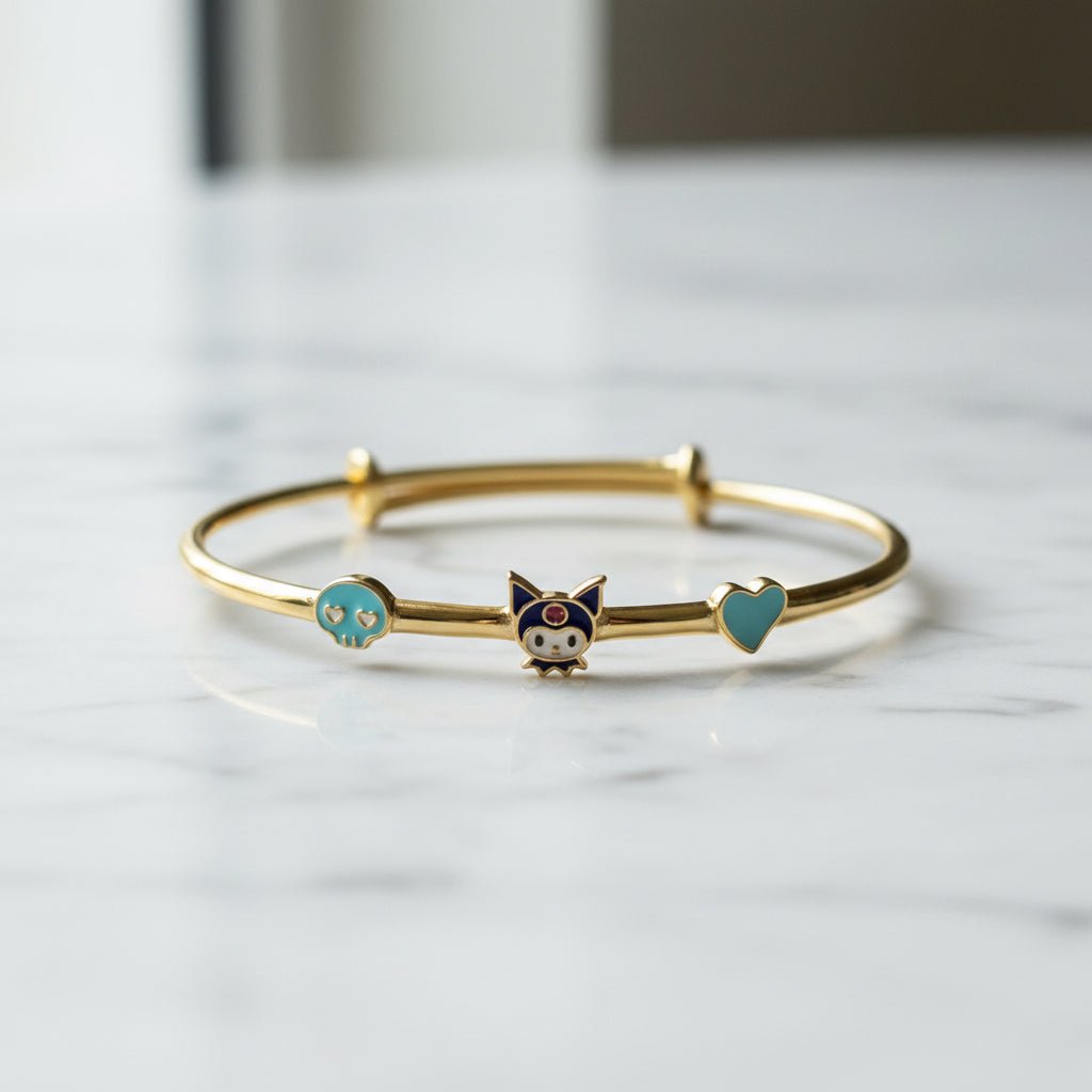 Gold-plated 925 sterling silver kids' adjustable bangle with enamel cartoon character, skull and heart charms