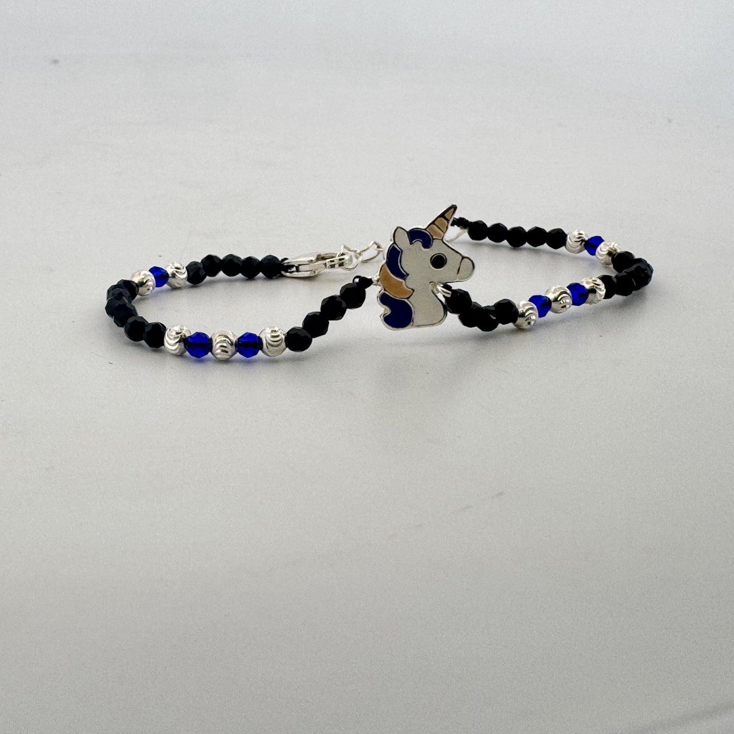 Enamel unicorn blue & black bead 925 silver kids bracelet | whimsical birthday gifting bracelet - image 1