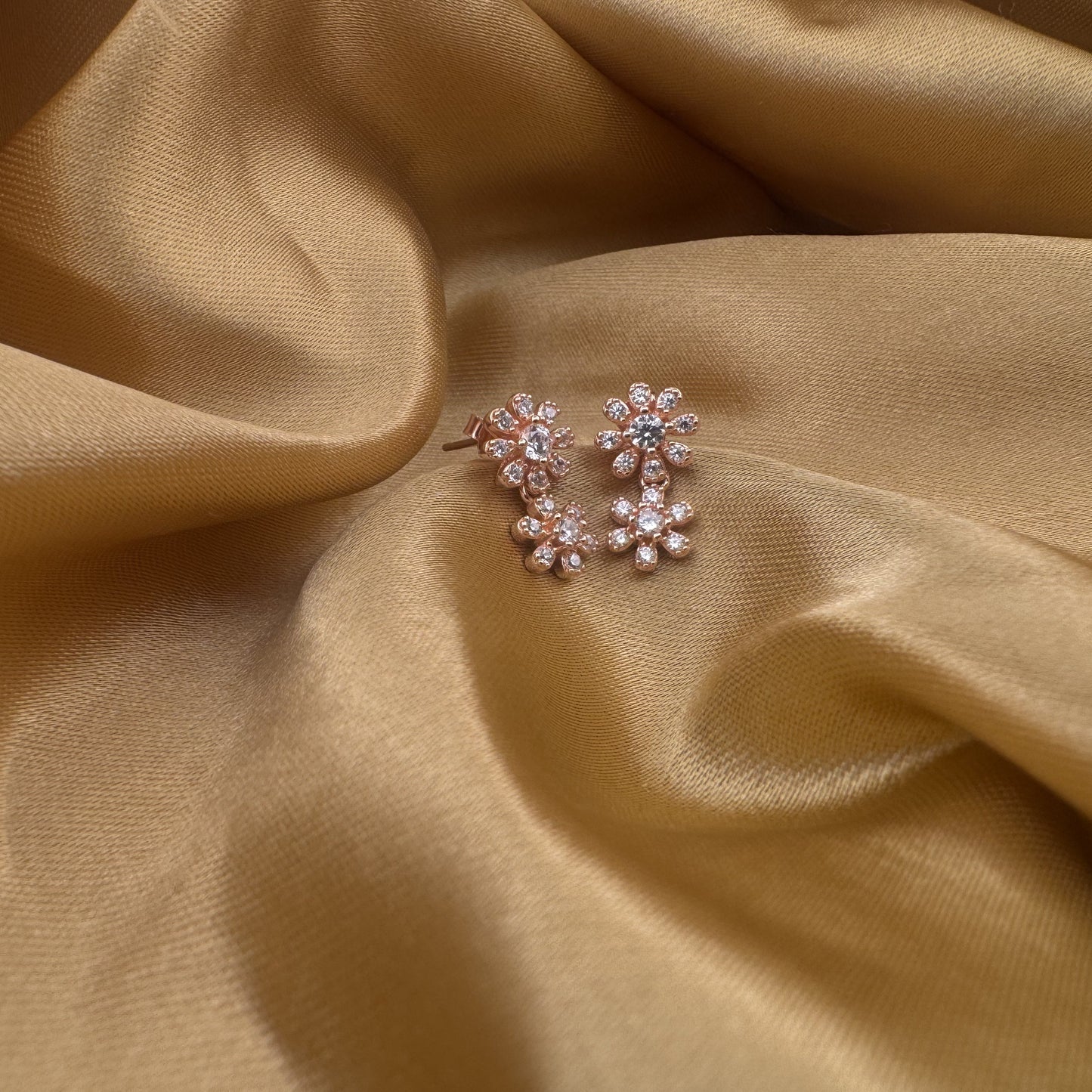 White AD twin daisy rose gold silver earrings | festive sparkle, effortlessly layered - image 1